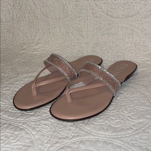 Italian shoemaker: Pink sandals/jeweled accents.